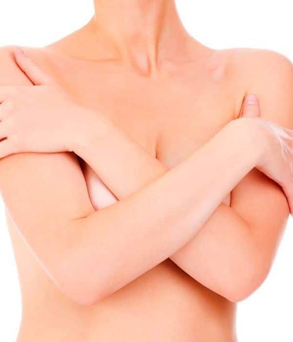 woman covering her breasts