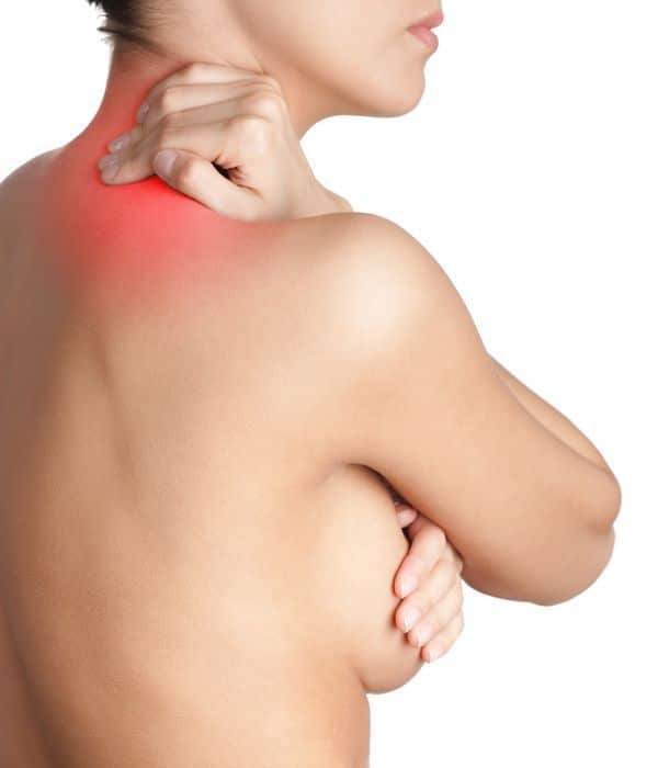 woman holding her neck in pain 